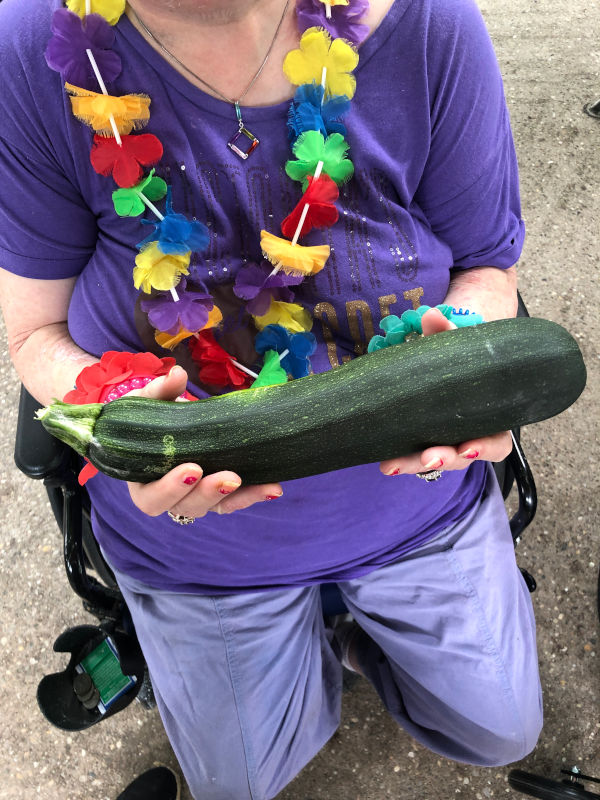 Woman holds a zucchini